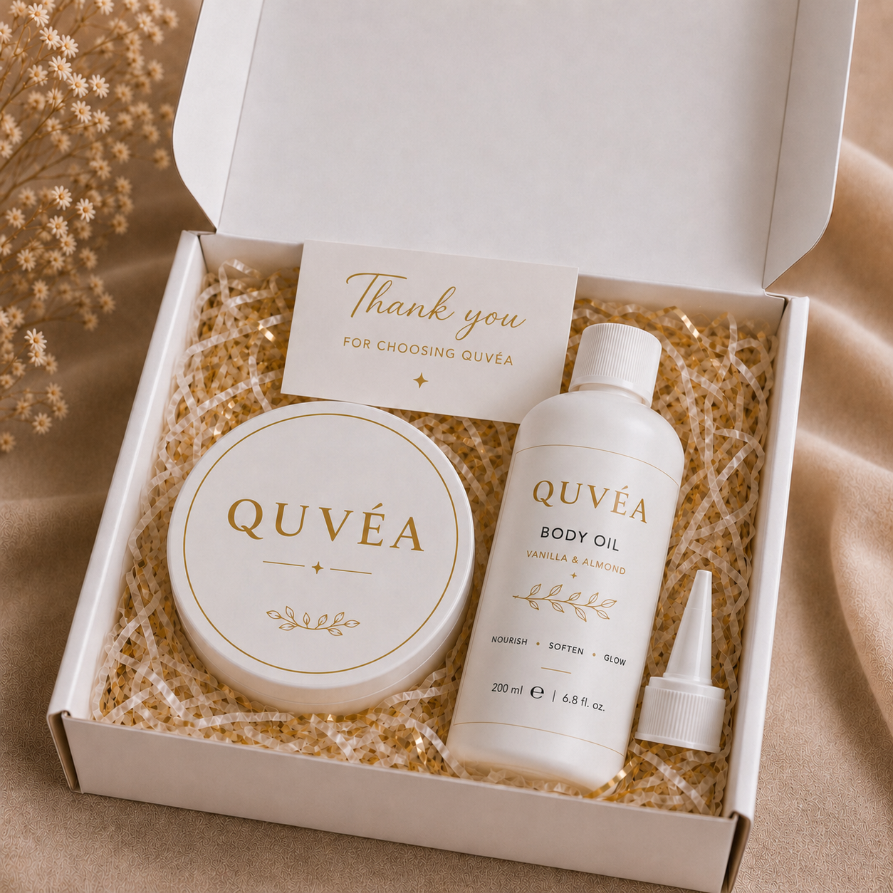 QUVÉA Package Set box containing the Shea Body Butter jar and Body Oil bottle